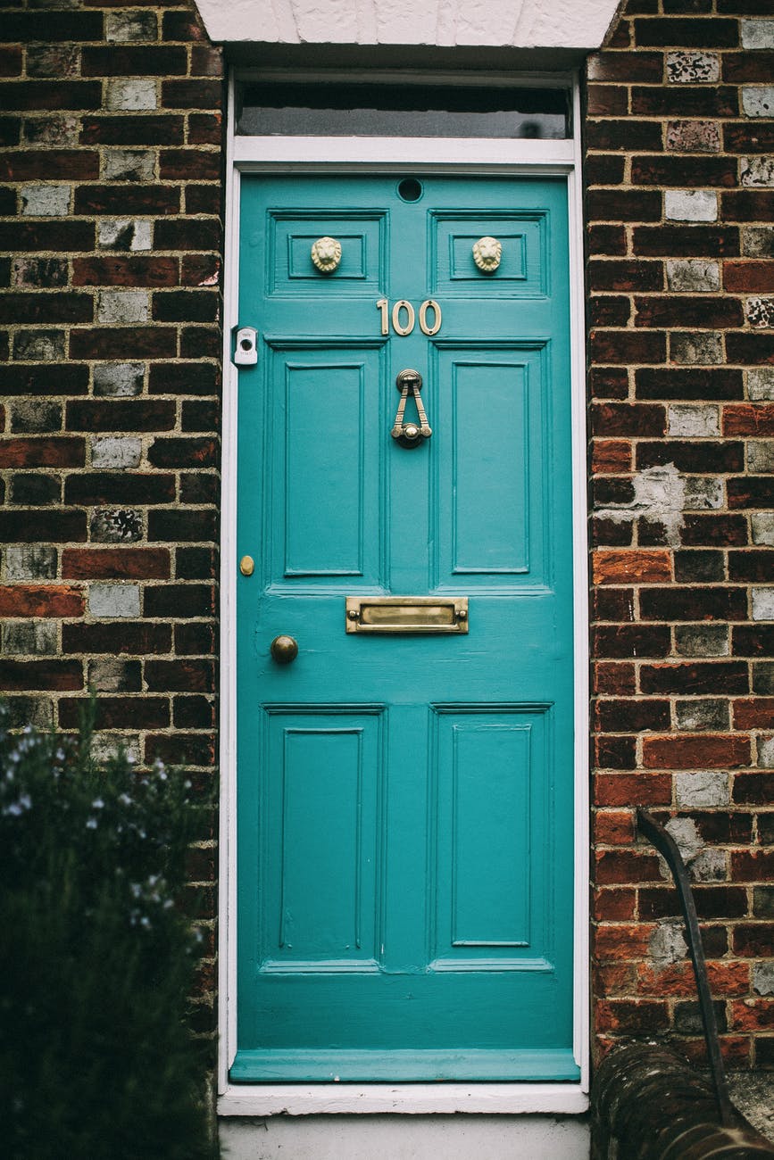 teal wooden panel door